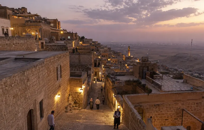 Historic stone streets and hillside architecture in Mardin at dusk