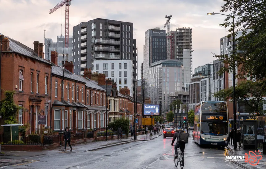 Modern apartment buildings and traditional housing in a regenerating Manchester neighborhood