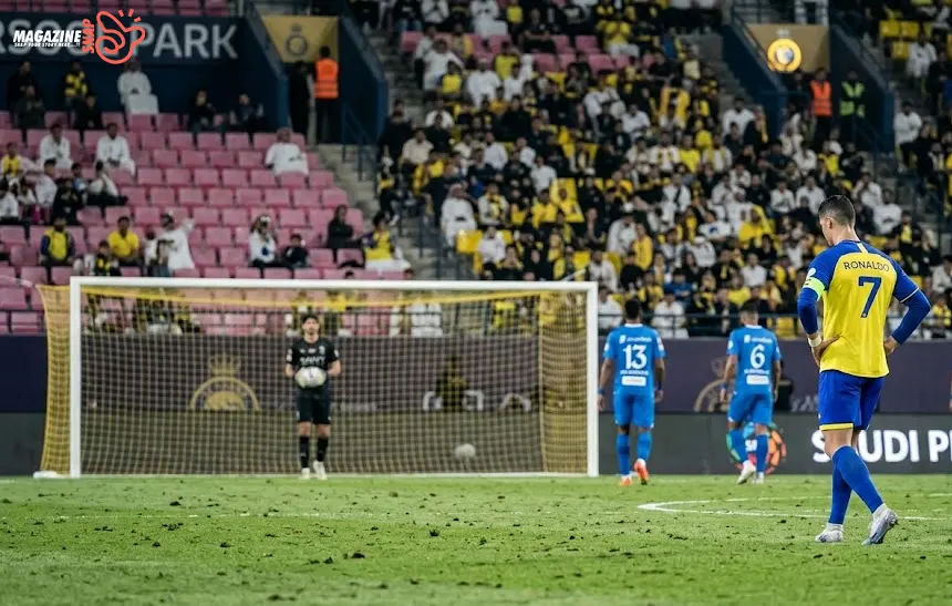Cristiano Ronaldo walking away after a missed free kick during a Saudi Pro League match.