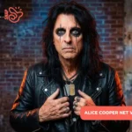 Alice Cooper net worth portrait, rocker in leather jacket with dark eye makeup