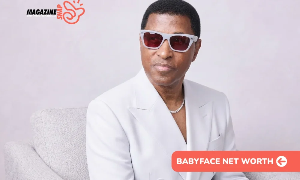 Babyface Net Worth: man in white suit and tinted sunglasses seated on gray chair