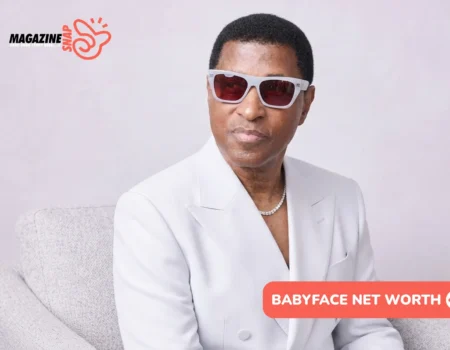 Babyface Net Worth: man in white suit and tinted sunglasses seated on gray chair