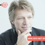 Bon Jovi net worth feature image, close-up portrait with hand on chin