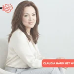 Claudia Haro net worth profile photo, woman in cream blouse seated in armchair
