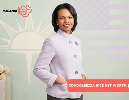 Condoleezza Rice smiling in lavender blazer with pearl earrings and brooch pin