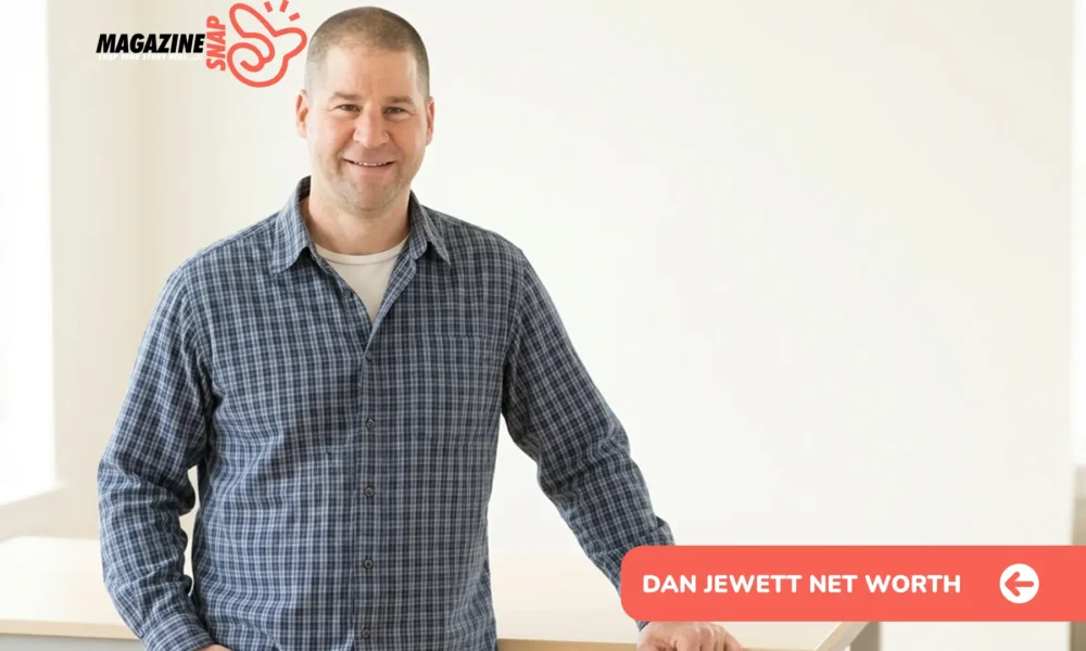 Dan Jewett net worth 2026 - man in blue plaid shirt smiling indoors