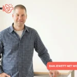 Dan Jewett net worth 2026 - man in blue plaid shirt smiling indoors