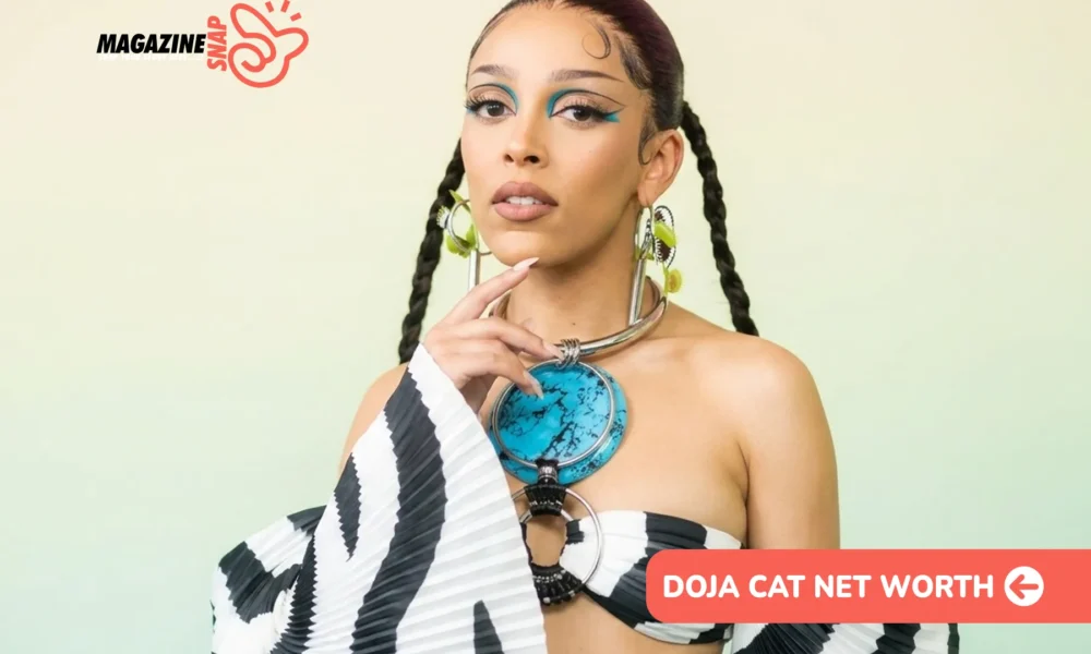 Doja Cat in zebra-print off-shoulder top with turquoise statement necklace