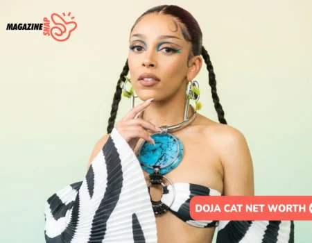 Doja Cat in zebra-print off-shoulder top with turquoise statement necklace