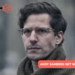 Andy Samberg in glasses and a knit scarf, close-up for the Andy Samberg net worth article