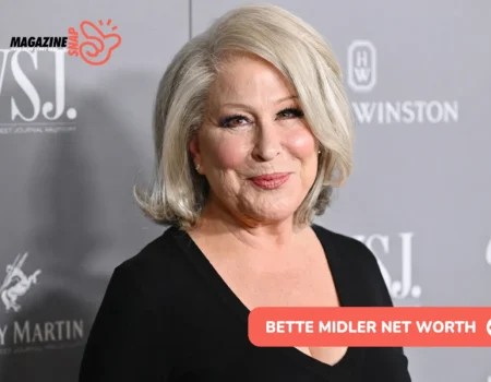 Bette Midler at a media event in a black top, pictured for the Bette Midler net worth article