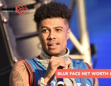 Blueface performing on stage in a jersey and gold chains for the Blue Face net worth article