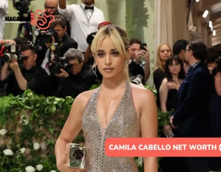 Camila Cabello net worth photo: sequined gown, red carpet, updo hairstyle.