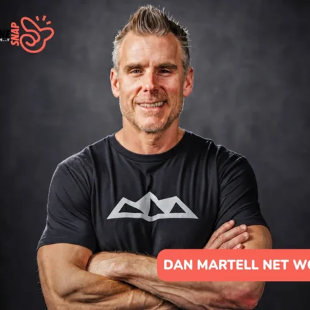 Dan Martell net worth smiling with arms crossed for the Dan Martell article