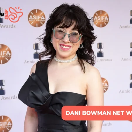 Dani Bowman Net Worth article image, woman in black gown at Annie Awards backdrop