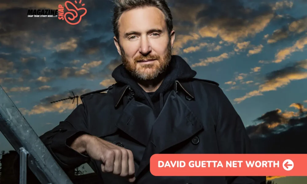 David Guetta net worth leans on a rooftop railing at dusk in a dark coat for the article.