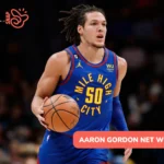 Aaron Gordon net worth article photo: Nuggets forward dribbling in "Mile High City" jersey
