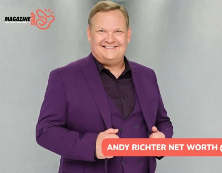 Andy Richter Net Worth - the comedian and actor smiling in a purple three-piece suit