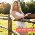 Belle Delphine Net Worth, Blonde woman in white outfit leaning on fence, used for article