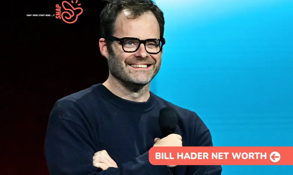 Bill Hader Net Worth 2026 – $14M Estimate and Emmy Wins for Barry Bill Hader smiling with a microphone on stage, image for the Bill Hader net worth article.
