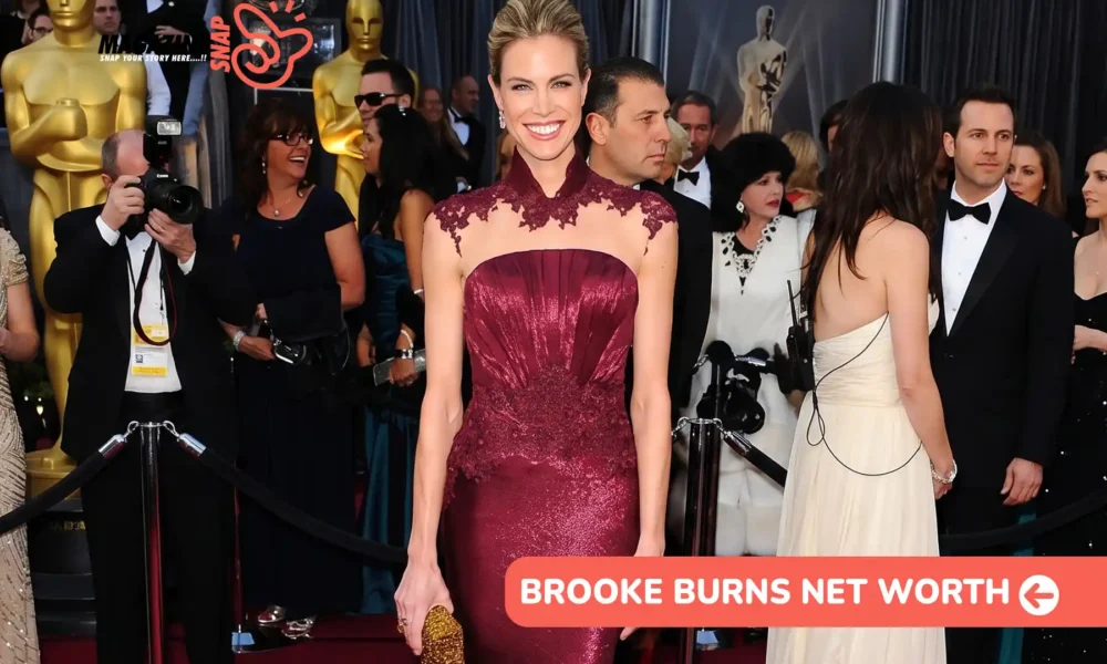 Brooke Burns in a burgundy lace-trim gown on a red carpet for the Brooke Burns net worth article.