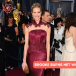 Brooke Burns in a burgundy lace-trim gown on a red carpet for the Brooke Burns net worth article.