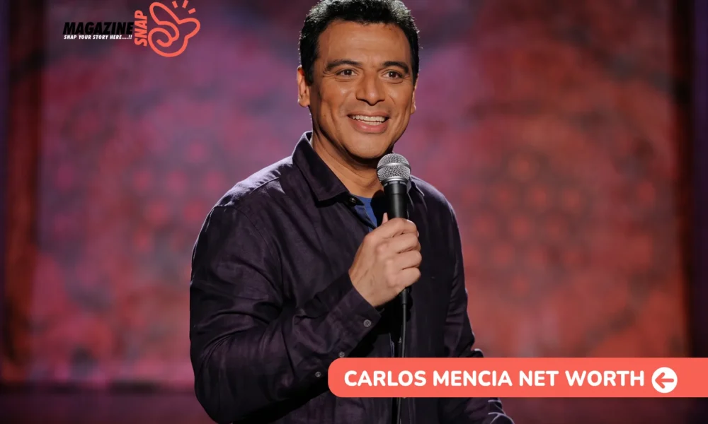 Carlos Mencia smiling on stage with a microphone in a purple shirt, Carlos Mencia net worth article photo