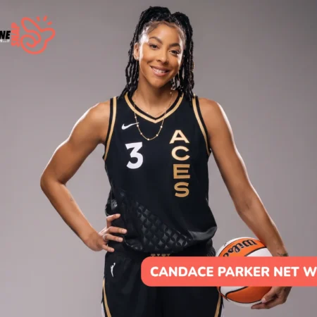 Candace Parker in a black and gold Aces jersey holding a basketball, for the Candace Parker net worth article