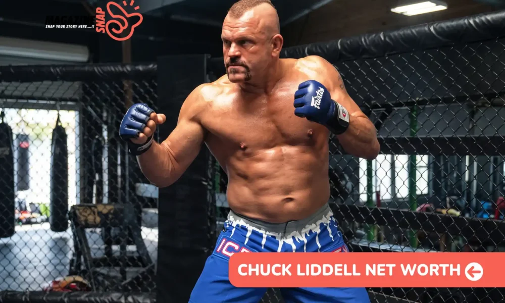 Chuck Liddell net worth article photo: fighter in blue gloves and shorts in a fighting stance beside a cage