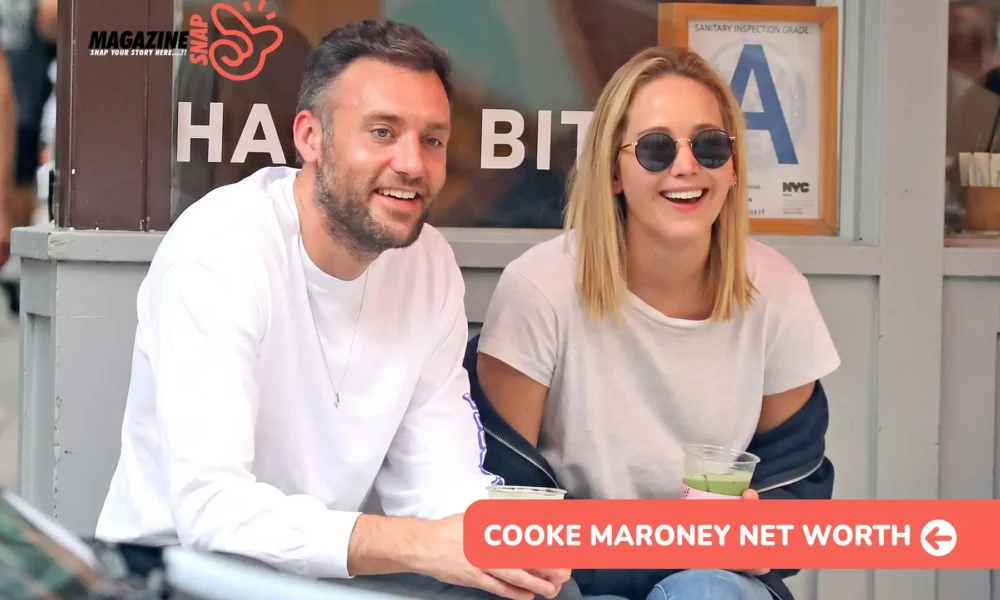 Cooke Maroney net worth article: two people laughing with iced drinks, seated outside a cafe